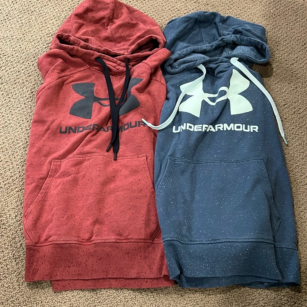 Two women’s hooded Under Armour sweatshirts.  Size large.